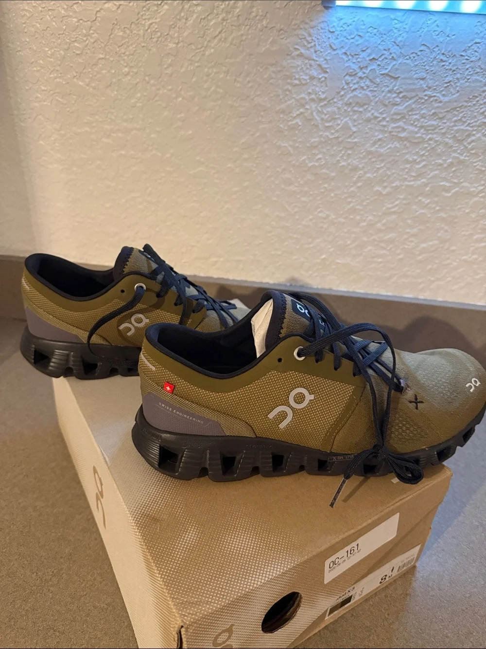 On cloud X3 in hunter and black. New with box.